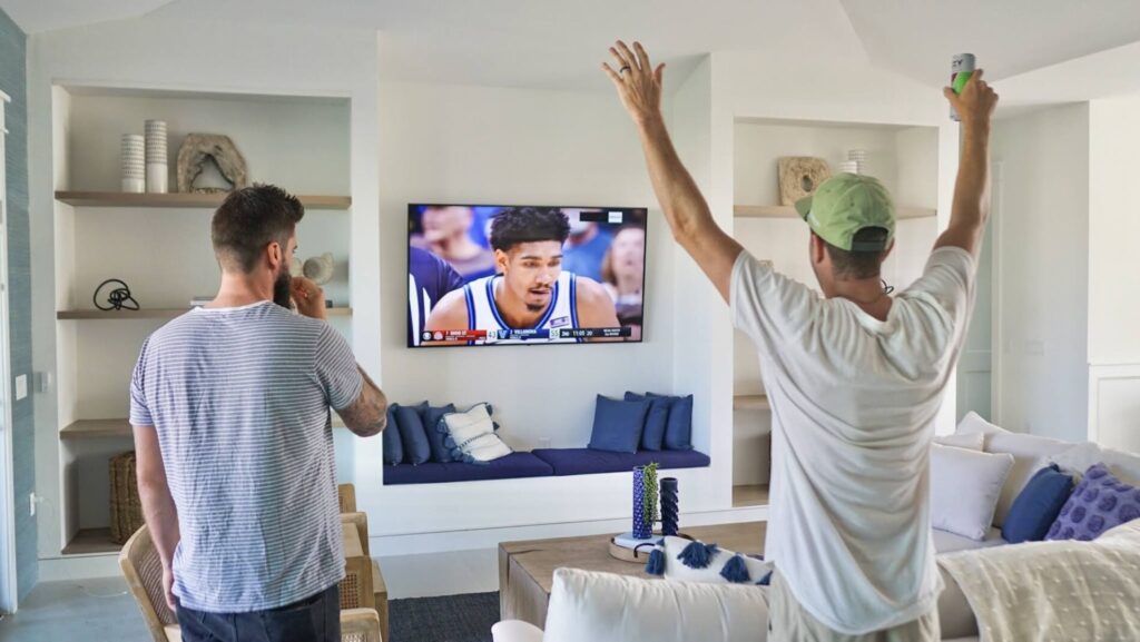 friends cheering on basketball team