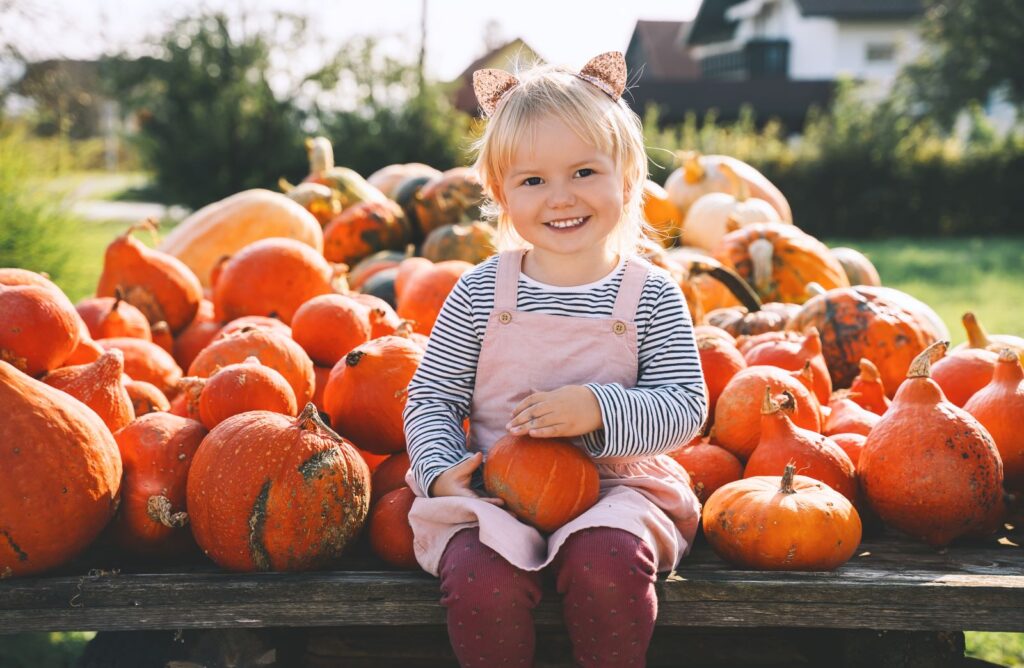 Little girl at pumpkin patch