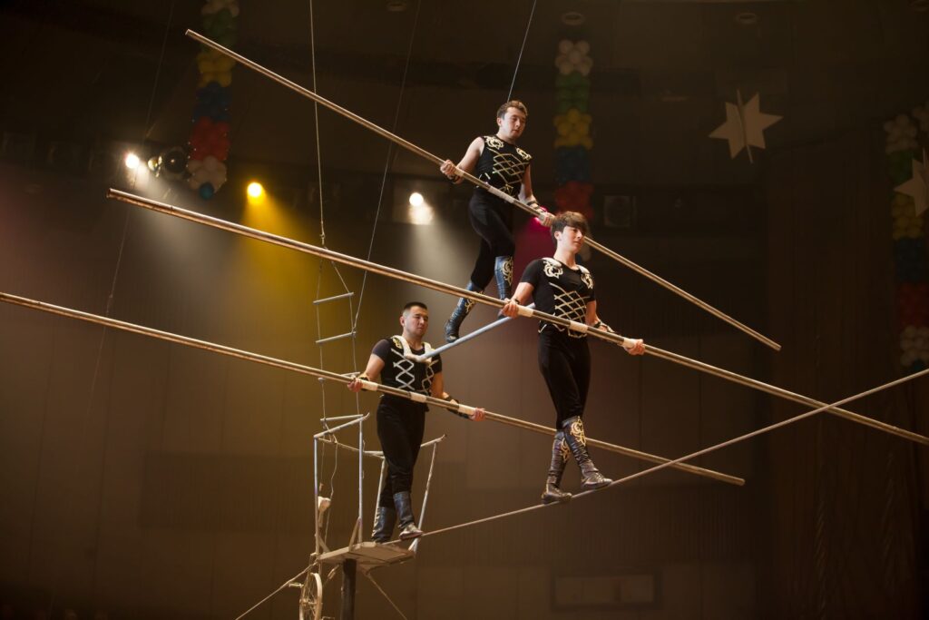 performers walking a tight rope