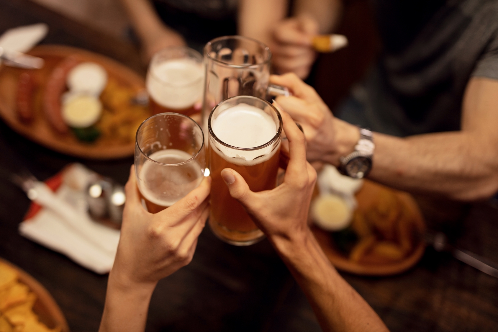 group with beer and food at tavern